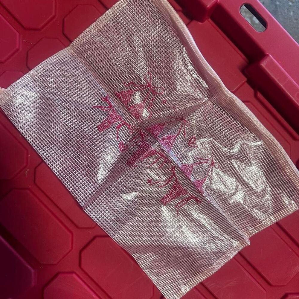Pink swim bag with bikinis